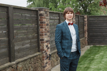 Fototapeta premium portrait of a stylish happy groom