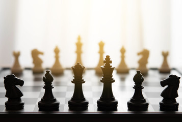 chess pieces on a chessboard for ideas and competition and strategy. business success concept