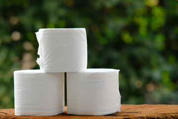 Hygienic mask and toilet paper for virus protection on wood background