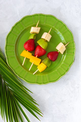 Healthy assorted fruit skewers from above