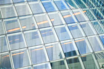 Spider glazing system, Curtain wall in curve, Frame less glass facades modern office building, tempered laminated glasses wall. curtain wall. Abstract concept for architecture background.