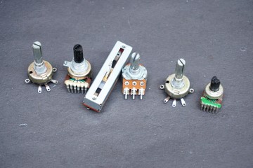 electronic component called a potentiometer. A potentiometer is a three-terminal resistor with a...