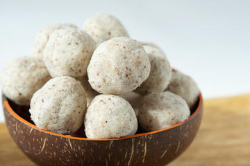 Fototapeta na wymiar homemade coconut energy balls with almond. healthy sugar free concept. keto diet recipe. close up view.