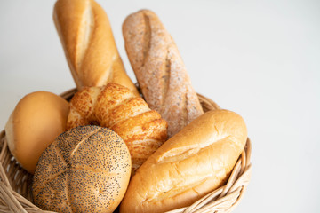 Variety of fresh homemade bread white background