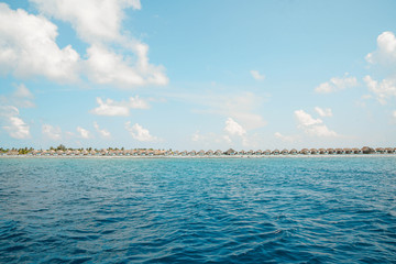 Beautiful Landscape of Over ocean Tropical beach summer resort hotel and spa, Maldives island with sea and sky tranquil for holiday vacation