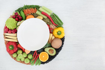 Vegan food for clean eating concept with foods high in protein, vitamins, minerals, anthocyanins, antioxidants, omega 3, smart carbs and dietary fibre. Flat lay on rustic wood background. Copy space.
