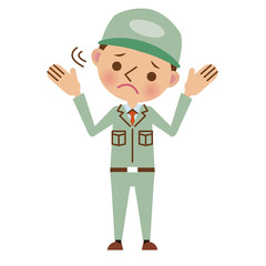 困った表情の作業服姿の男性