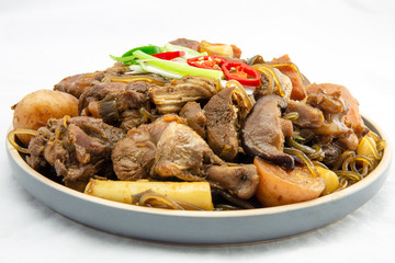 Korean chicken stew with soy sauce, glass noodle, rice cake and vegetables