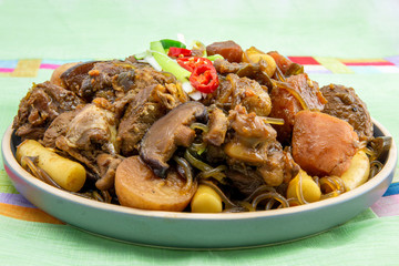 Korean chicken stew with soy sauce, glass noodle, rice cake and vegetables