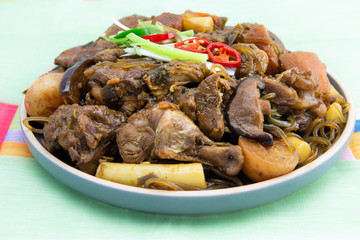 Korean chicken stew with soy sauce, glass noodle, rice cake and vegetables
