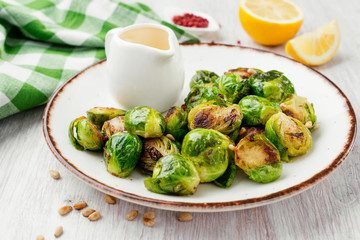 Homemade roasted brussel sprouts with pine nuts and butter sauce