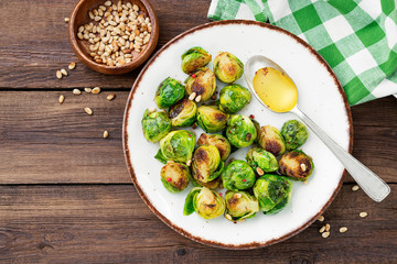 Homemade roasted brussel sprouts with pine nuts and butter sauce