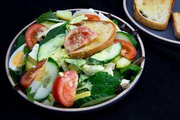 Egg, Feta, and some vegetable salad like cucumber, tomato and potato