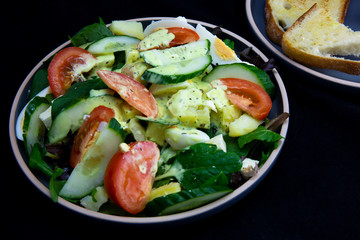 Egg, Feta, and some vegetable salad like cucumber, tomato and potato