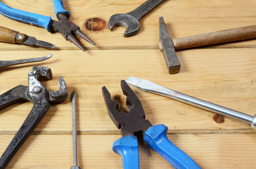 Construction tools on a wooden background