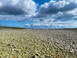 Dry river, sky and stones.