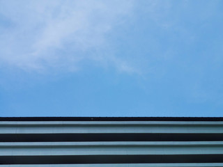 Empty sky with fog white cloud against strip line building.