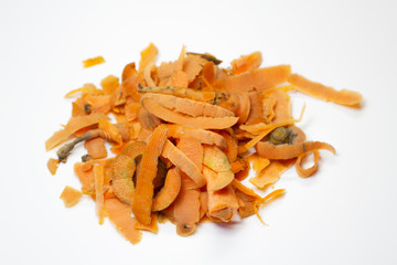 Food waste carrot on a white background. Isolate. Top view. Close up. Waste for recycling. Responsible disposal of household food wastage in an environmentally friendly way by recycling.
