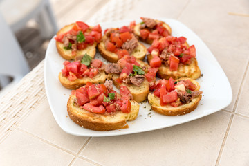 Appetizer of bruschetta with tuna