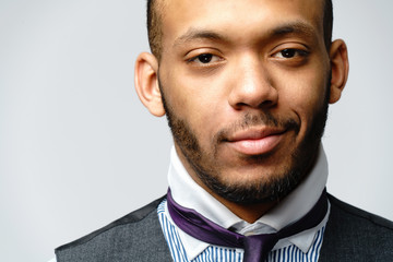 African-American man face portrait over grey background