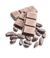 Milk chocolate bars and cocoa beans