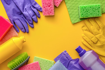 Set of cleaning supplies on color background