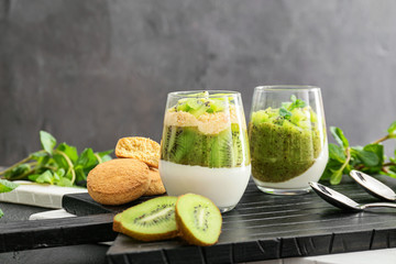 Glasses with tasty panna cotta on table
