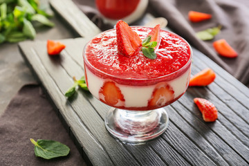 Tasty panna cotta on table