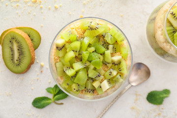 Glass with tasty panna cotta on white background
