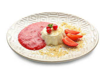 Plate with tasty panna cotta on white background