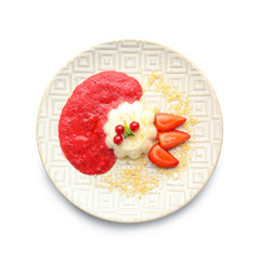 Plate with tasty panna cotta on white background