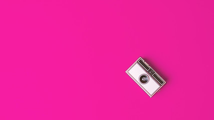 Retro vintage Photo Camera on a fuchsia Background
