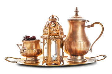 Muslim lamp, teapot and dates on white background