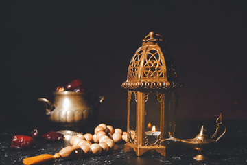 Muslim lamps with tasbih on dark background