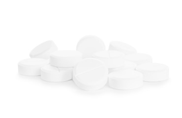 Heap of pills on white background