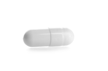 One pill on white background