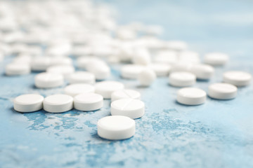 Many pills on color background