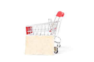 Empty shopping cart with blank paper card isolate on white background