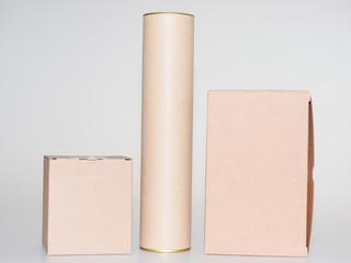 Cardboard boxes and tube brown on white grey background