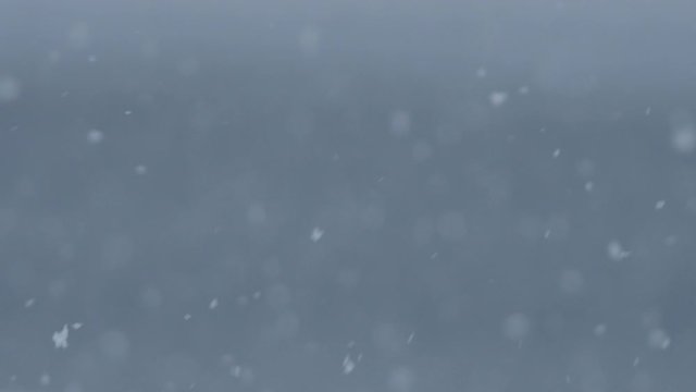 Slow motion snowfall with blurred background