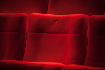 Empty seat number thirteen in the cinema