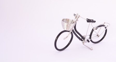 The bicycle is made of wire on a white ground