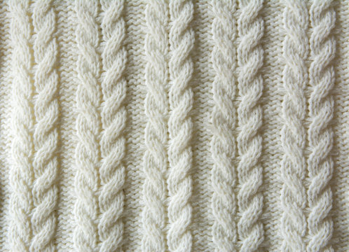 White Knitted wool texture of a fabric with cable knit pattern Stock Photo  | Adobe Stock
