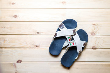 Flip flops on a wooden background