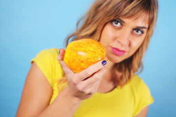 Young woman with apple 