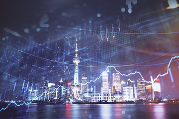 Financial graph on night city scape with tall buildings background multi exposure. Analysis concept.