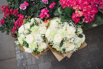 A small business for selling flowers. Blue and pink hydrangeas, white flowers in a street store. Top view.