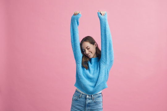 Excited Happy Girl Holding Her Hands Up Celebrating Feeling Young And Free