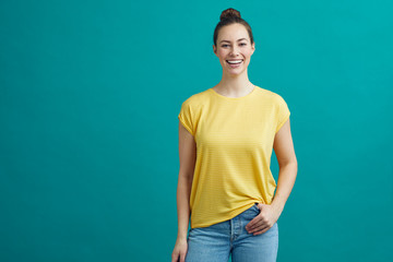 Portrait of happy young woman on a colorful background
