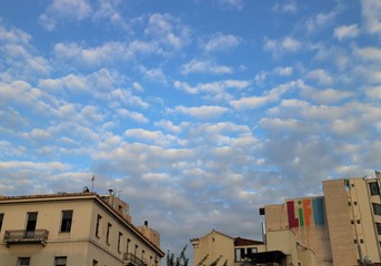 old building and white clouds with blue sky in Athens, Greece
